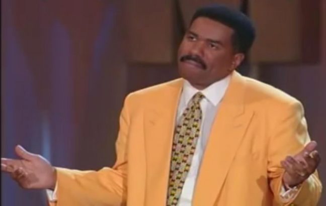 Steve Harvey in a yellow suit (with hair on his head)