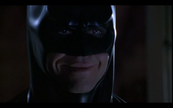 Val Kilmer smiling, as Batman