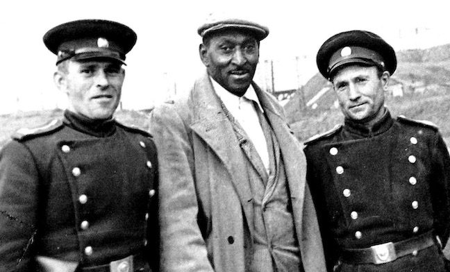 George Tynes, flanked by Soviet army cadets