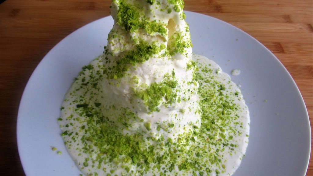 Sheer yakh, ice cream on a plate covered with chopped pistachios