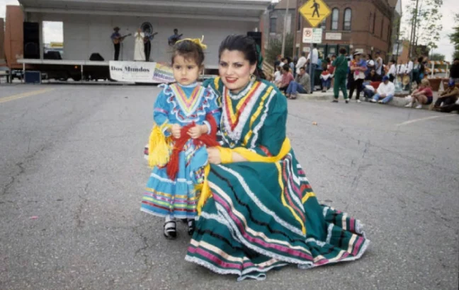 A woman and girl wearing Jalisco dresses pose for a photo at a Kansas City Cinco de Mayo celebration (1998)
