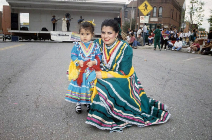 A woman and girl wearing Jalisco dresses pose for a photo at a Kansas City Cinco de Mayo celebration (1998)